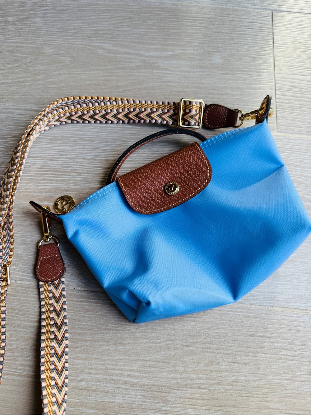 Light Blue Crossbody Bag with Brown Trim and Removable Patterned Strap